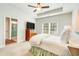 Cozy main bedroom with a ceiling fan, natural light, and an en suite bathroom at 474 Wraggs Ferry Rd., Georgetown, SC 29440