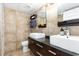 Bathroom featuring double sinks, and decorative tile walls at 4800 S Ocean Blvd. # 1514, North Myrtle Beach, SC 29582