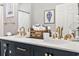 Stylish bathroom featuring a double vanity with marble countertops and elegant fixtures at 4817 Magnolia Lake Dr. # 104, Myrtle Beach, SC 29577