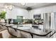 Bright kitchen with white cabinets, dark countertops, stainless steel appliances, and green tiled backsplash at 4817 Magnolia Lake Dr. # 104, Myrtle Beach, SC 29577