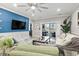 Open concept living room with a nautical-themed blue accent wall and comfortable seating at 4817 Magnolia Lake Dr. # 104, Myrtle Beach, SC 29577