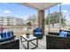 Relaxing outdoor patio featuring comfortable seating and a peaceful water view at 4817 Magnolia Lake Dr. # 104, Myrtle Beach, SC 29577