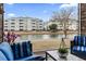 Inviting patio overlooking a serene pond and well-maintained landscaping at 4817 Magnolia Lake Dr. # 104, Myrtle Beach, SC 29577