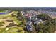 Aerial view of condos with balconies near golf course and community at 5060 Windsor Green Way # 304, Myrtle Beach, SC 29579