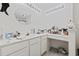 Well-lit bathroom featuring a vanity area with plenty of counter space, drawers, and a decorative mirror at 5060 Windsor Green Way # 304, Myrtle Beach, SC 29579