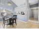 Dining room with laminated floors is adjacent to a galley kitchen at 5060 Windsor Green Way # 304, Myrtle Beach, SC 29579