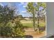 Scenic view of a lush green golf course and distant clubhouse from a balcony on a sunny day at 5060 Windsor Green Way # 304, Myrtle Beach, SC 29579