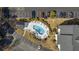 Aerial shot of a pool with chairs and umbrellas, surrounded by landscaping and parking lot in complex at 5060 Windsor Green Way # 304, Myrtle Beach, SC 29579