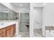 Modern bathroom featuring a glass-enclosed shower and separate tub at 52 Olde Canal Loop, Pawleys Island, SC 29585