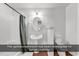 Well-lit bathroom featuring a pedestal sink, toilet, and shower/tub combination at 52 Olde Canal Loop, Pawleys Island, SC 29585