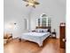 Bright bedroom with vaulted ceiling, large windows, and wood floors at 52 Olde Canal Loop, Pawleys Island, SC 29585