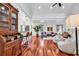 Spacious open-concept living room with hardwood flooring, contemporary furnishings, and ample natural light at 52 Olde Canal Loop, Pawleys Island, SC 29585