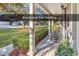 Inviting front porch with classic columns and rocking chairs, perfect for relaxing at 52 Olde Canal Loop, Pawleys Island, SC 29585