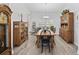 Elegant dining room with a large wooden table, decorative cabinets, and bright lighting at 521 Harbison Circle, Myrtle Beach, SC 29579