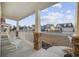 View from the covered porch with stone pillars and white rocking chairs at 521 Harbison Circle, Myrtle Beach, SC 29579