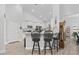 Kitchen featuring breakfast bar and view of open floor plan with white cabinets at 521 Harbison Circle, Myrtle Beach, SC 29579