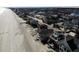 An aerial view of homes and the coastline showing the beach and ocean at 547 South Waccamaw Dr., Garden City Beach, SC 29576