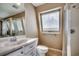 Bathroom with a glass shower, vanity with marble top, and a large mirror at 547 South Waccamaw Dr., Garden City Beach, SC 29576