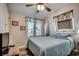 Cozy bedroom with a plush bed, ample natural light, and ceiling fan at 547 South Waccamaw Dr., Garden City Beach, SC 29576