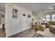 Inviting entryway featuring hardwood floors, a charming lighthouse print, and a glimpse into the living space at 547 South Waccamaw Dr., Garden City Beach, SC 29576