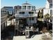 Beach house featuring multiple decks, ocean views, and direct beach access at 547 South Waccamaw Dr., Garden City Beach, SC 29576