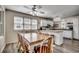 Bright eat-in kitchen featuring modern appliances, white cabinetry, and a large dining table for Gathering meals at 547 South Waccamaw Dr., Garden City Beach, SC 29576