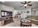 Cozy living room showcasing a fireplace, comfortable seating, and an open view into the kitchen area at 547 South Waccamaw Dr., Garden City Beach, SC 29576