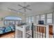 Cozy loft space featuring a bedroom, staircase, and plenty of natural light at 547 South Waccamaw Dr., Garden City Beach, SC 29576