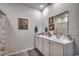 Bathroom featuring double sinks, white cabinets, and a shower at 583 Meadowgrass Ct., Myrtle Beach, SC 29588