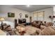 Cozy living room featuring plush sofas, area rug, and large windows for natural light at 583 Meadowgrass Ct., Myrtle Beach, SC 29588