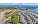 Scenic aerial view of a neighborhood adjacent to a lush green golf course and winding community walking trails at 609 Gryffindor Dr., Longs, SC 29568