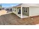 New backyard with patio and green siding at 609 Gryffindor Dr., Longs, SC 29568