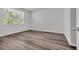 Bedroom featuring wood-look flooring and bright window at 609 Gryffindor Dr., Longs, SC 29568