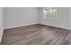 Bright bedroom showcasing wood-look flooring and a window for natural light at 609 Gryffindor Dr., Longs, SC 29568