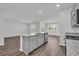 Modern kitchen island with stone countertops at 609 Gryffindor Dr., Longs, SC 29568