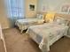 Bedroom featuring two twin beds with matching quilt sets and cool green walls at 637 Waterway Village Blvd. # 13-E, Myrtle Beach, SC 29579