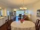 Inviting dining area with a round table set for a meal and featuring an open-concept living space at 637 Waterway Village Blvd. # 13-E, Myrtle Beach, SC 29579