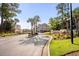 Waterway Village entrance gate, with the American flag and lush landscaping at 637 Waterway Village Blvd. # 13-E, Myrtle Beach, SC 29579