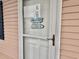 Welcoming front door adorned with a beach themed decorative sign in a residential community at 637 Waterway Village Blvd. # 13-E, Myrtle Beach, SC 29579