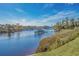 Scenic waterway view with a dock, gazebo, and lush landscape under a bright blue sky at 637 Waterway Village Blvd. # 13-E, Myrtle Beach, SC 29579