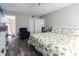 Cozy bedroom with a peek into the bathroom and hallway, decorated in neutral tones at 7603 N Ocean Blvd. # 4E, Myrtle Beach, SC 29572