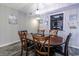 Dining area with a dark wood table, six chairs, and nautical decorations at 7603 N Ocean Blvd. # 4E, Myrtle Beach, SC 29572