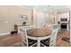 Cozy dining area featuring a round table with seating for four and decorative furnishings at 8155 Living Tide Dr., Myrtle Beach, SC 29572