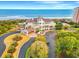 Stunning coastal building boasting a beautiful oceanfront view and elegant landscaping at 8155 Living Tide Dr., Myrtle Beach, SC 29572