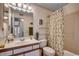 Bathroom featuring a white sink, toilet, and shower, complete with a decorative shower curtain at 8545 Hopkins Circle # G, Myrtle Beach, SC 29575