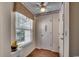 Bright hallway with wood floors, decorative wallpaper, and a window letting in natural light at 8545 Hopkins Circle # G, Myrtle Beach, SC 29575