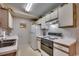 Functional kitchen featuring white appliances, tiled backsplash, and durable countertops at 8545 Hopkins Circle # G, Myrtle Beach, SC 29575