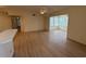 Bright living room featuring new wood floors, lots of natural light, and vaulted ceilings at 8545 Hopkins Circle # G, Myrtle Beach, SC 29575