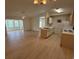 Open living space featuring updated flooring with vaulted ceilings overlooking the dining area and kitchen at 8545 Hopkins Circle # G, Myrtle Beach, SC 29575