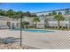 Community pool enclosed by a fence, offering a shared outdoor amenity for residents at 8545 Hopkins Circle # G, Myrtle Beach, SC 29575